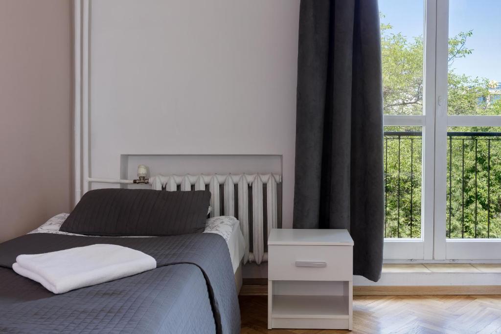Posteľ alebo postele v izbe v ubytovaní Tatamka Hostel