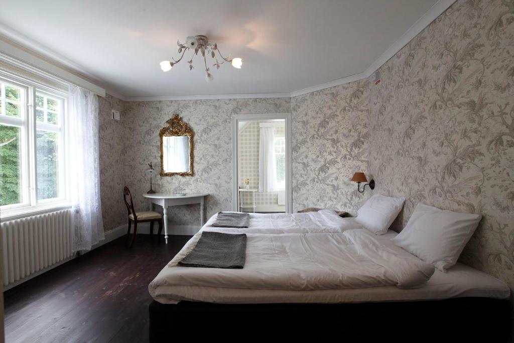 Postel nebo postele na pokoji v ubytování Ardrebo B&B
