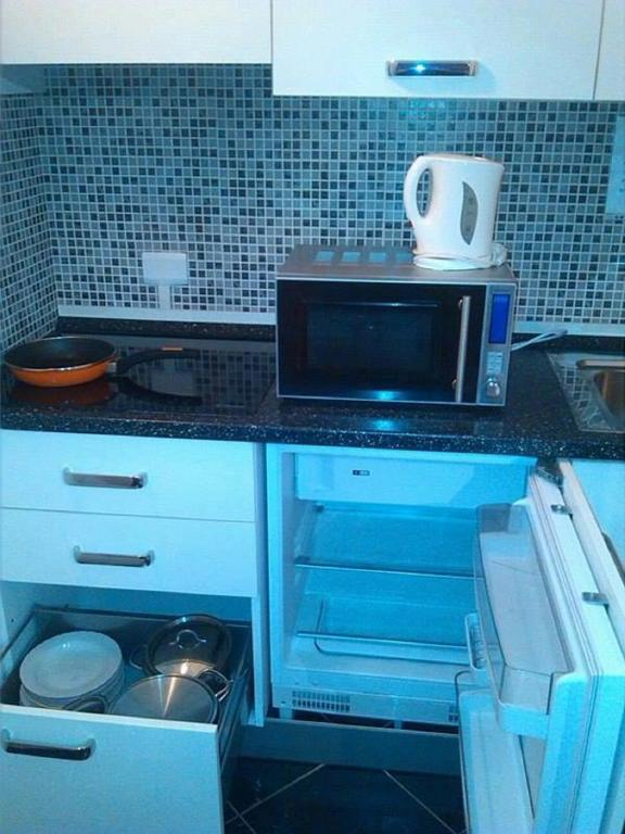 Kuchyň nebo kuchyňský kout v ubytování Affittacamere Sardegna Sole e Mare