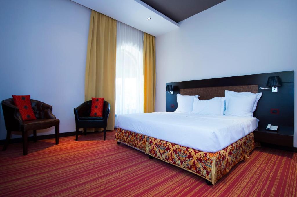 Postel nebo postele na pokoji v ubytování Nane Hotel
