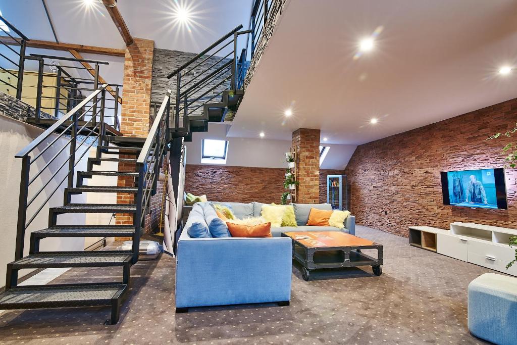 Posezení v ubytování Apartament Dwupoziomowy Nad Tamami