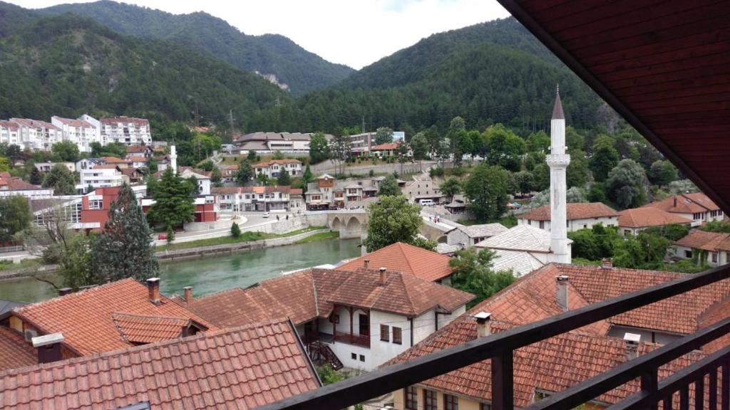 a view of a town with a river and buildings at Kamena Ćuprija in Konjic