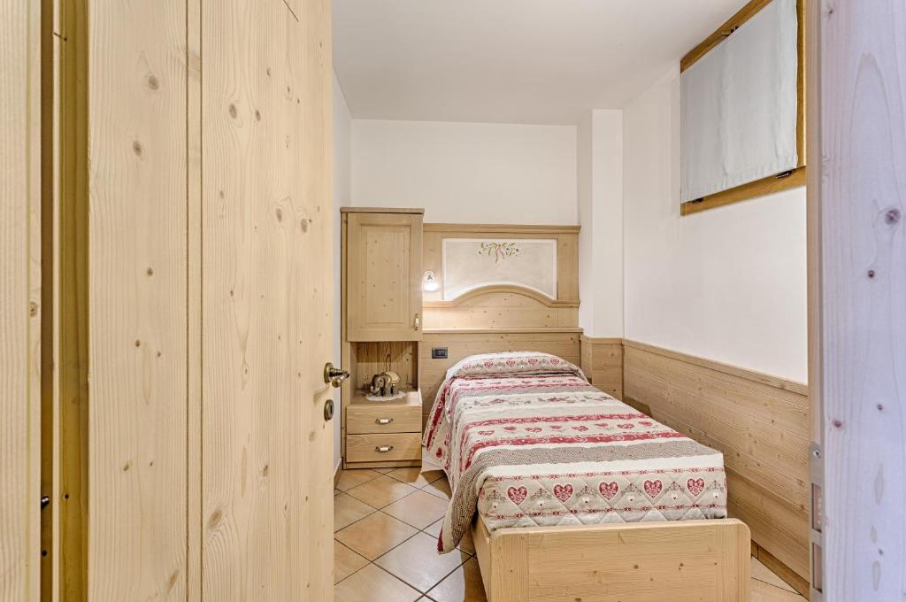 Postel nebo postele na pokoji v ubytování Residence Ronchi