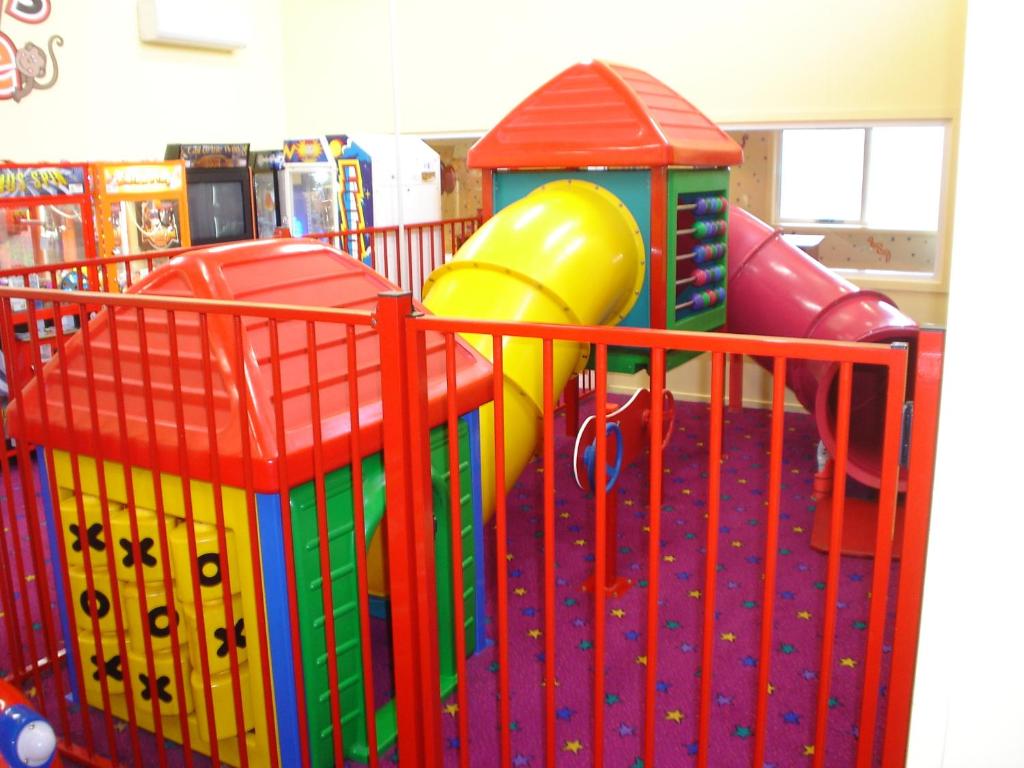 a playground with colorful play equipment in a store at Argosy Motor Inn in Devonport