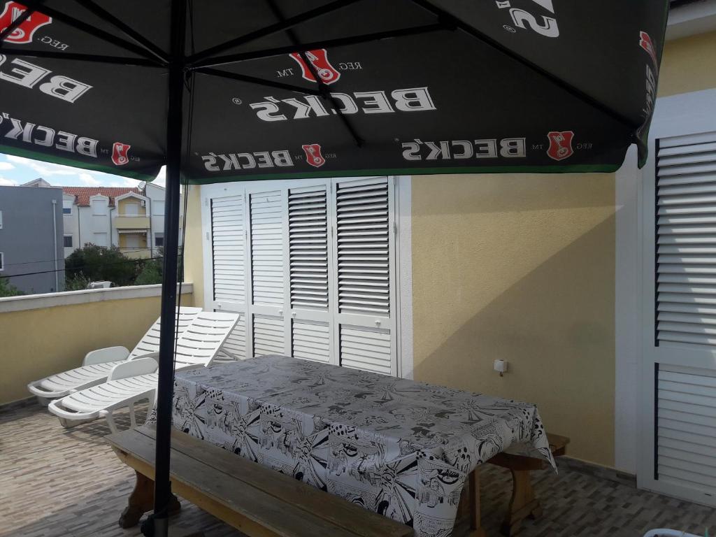 Postel nebo postele na pokoji v ubytování Apartments Sun & Sea