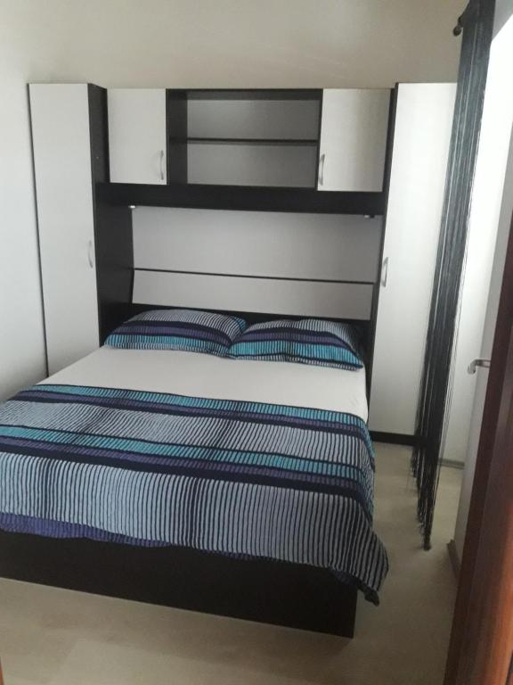 Postel nebo postele na pokoji v ubytování Apartments Sun & Sea