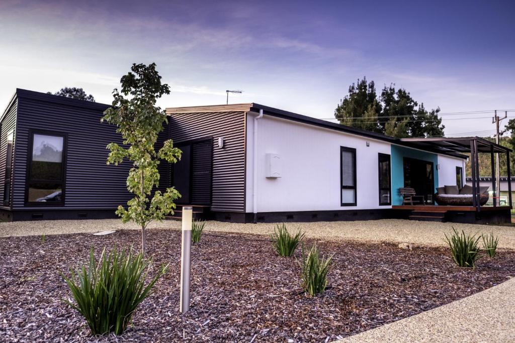 a house with a black and white facade at 2 Minutes By Bike - Bright, VIC in Bright