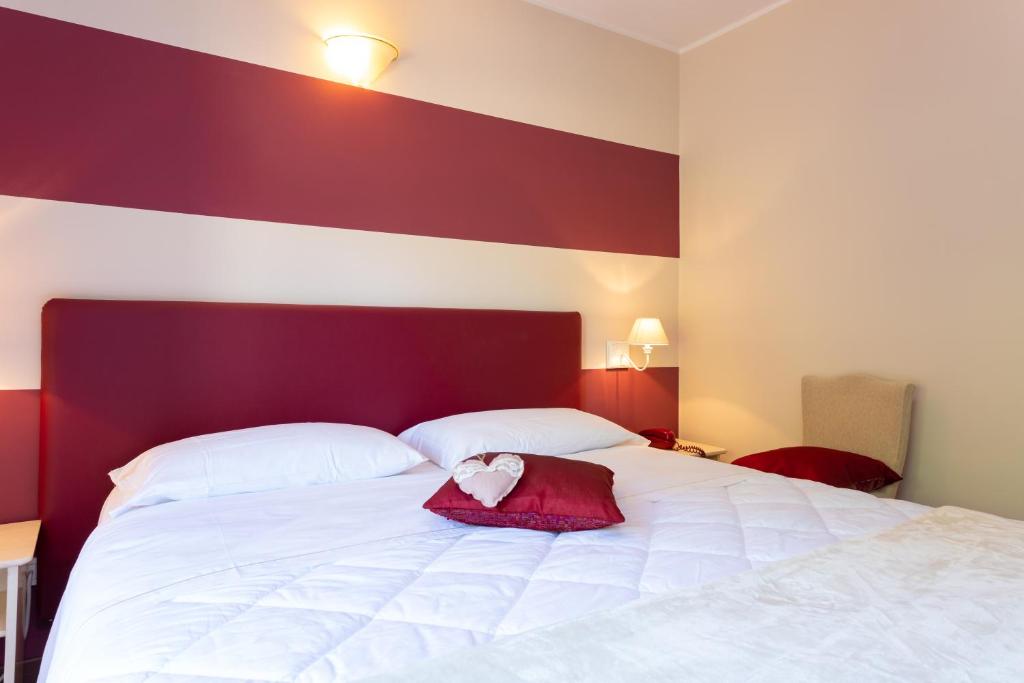 Posteľ alebo postele v izbe v ubytovaní West Garda Hotel