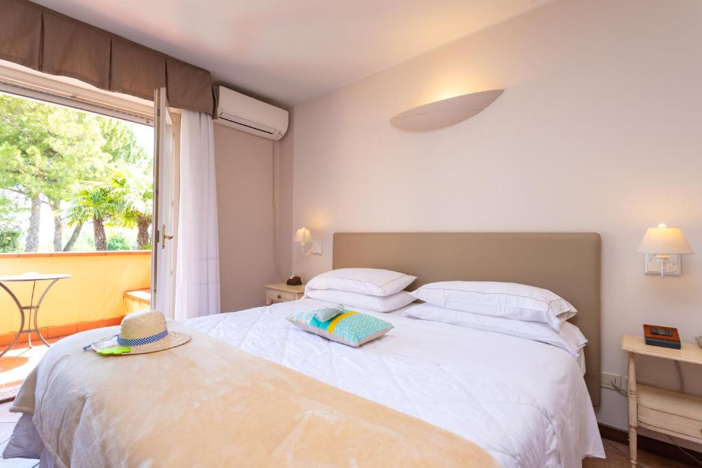 Posteľ alebo postele v izbe v ubytovaní West Garda Hotel