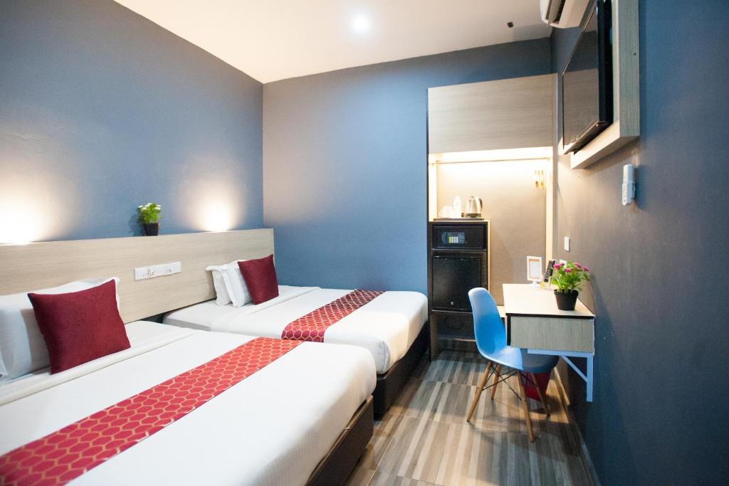 Postel nebo postele na pokoji v ubytování DJ Citi Inn Premier