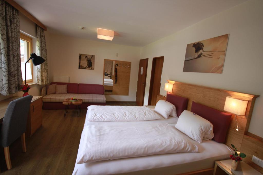 Postel nebo postele na pokoji v ubytování Haus Alexander