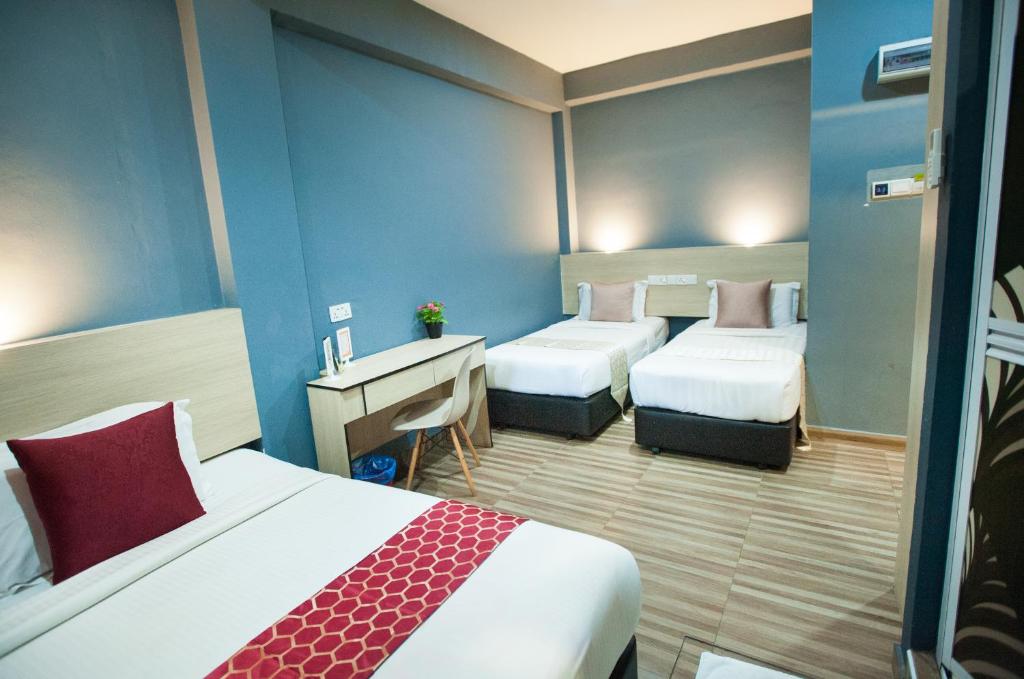 Postel nebo postele na pokoji v ubytování DJ Citi Inn Premier
