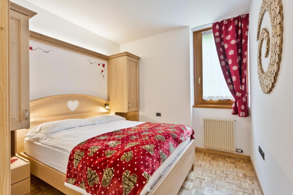 Postel nebo postele na pokoji v ubytování Residence Ronchi