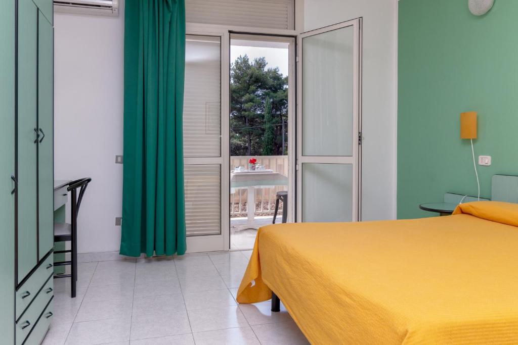 Postelja oz. postelje v sobi nastanitve Mini Hotel