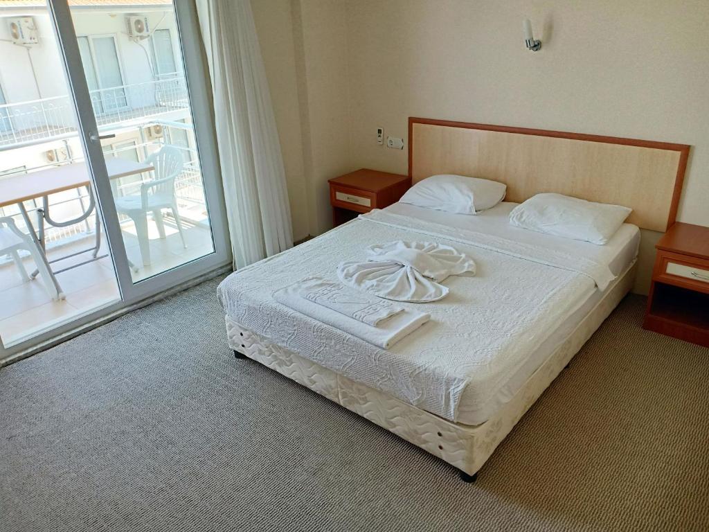 Postel nebo postele na pokoji v ubytování Sarıgerme Apart