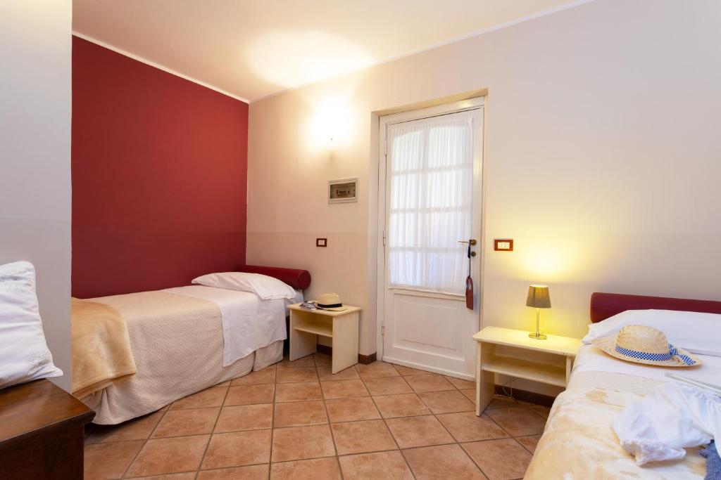 Posteľ alebo postele v izbe v ubytovaní West Garda Hotel