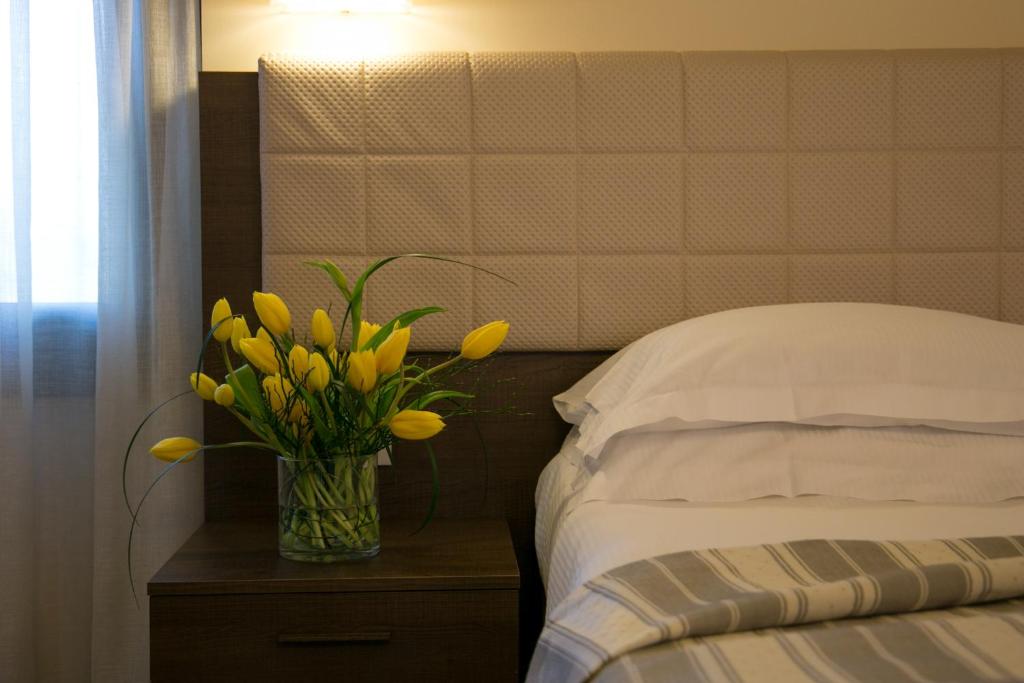 Postel nebo postele na pokoji v ubytování Hotel Calinferno