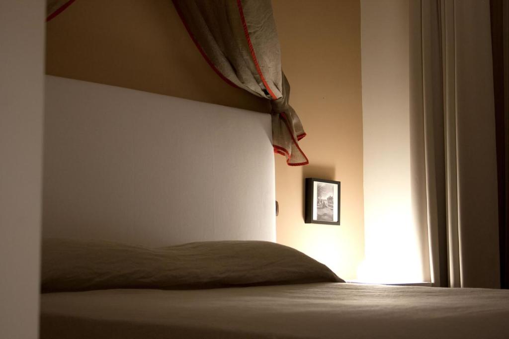 a bedroom with a bed and a window at Masseria Olivola in Benevento