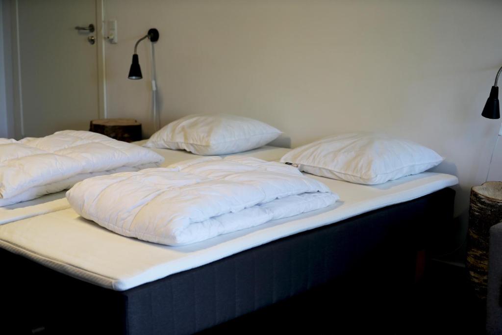Uma cama ou camas num quarto em Thommysminde