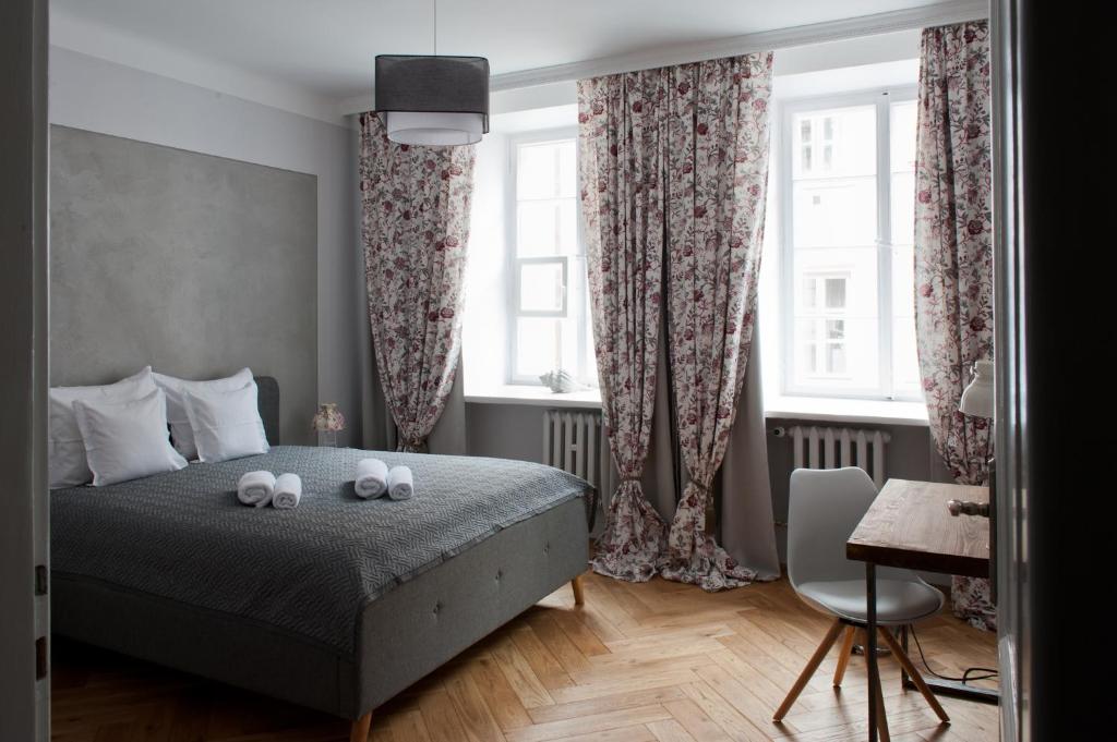 Posteľ alebo postele v izbe v ubytovaní Red Brick Old Town Apartment