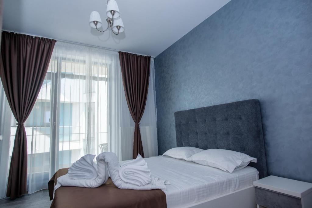 Postel nebo postele na pokoji v ubytování Constantinos Apartment Mamaia Nord