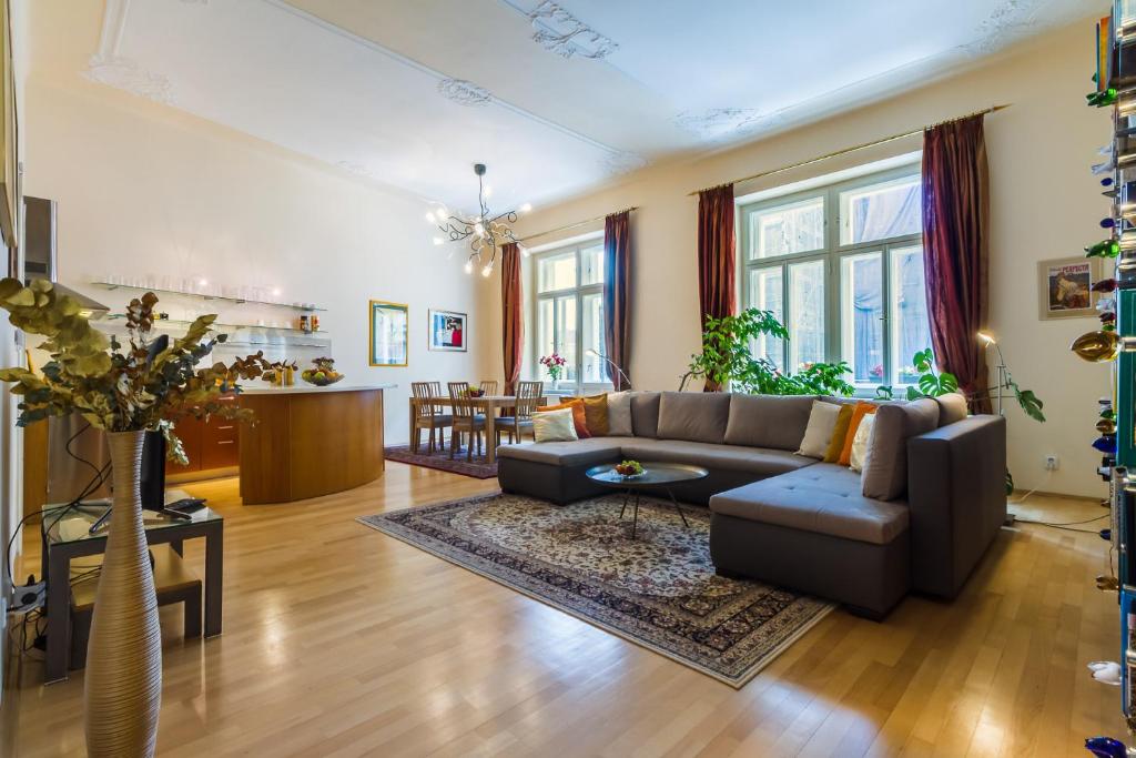 a living room with a couch and a table at Apartment Victor in Prague