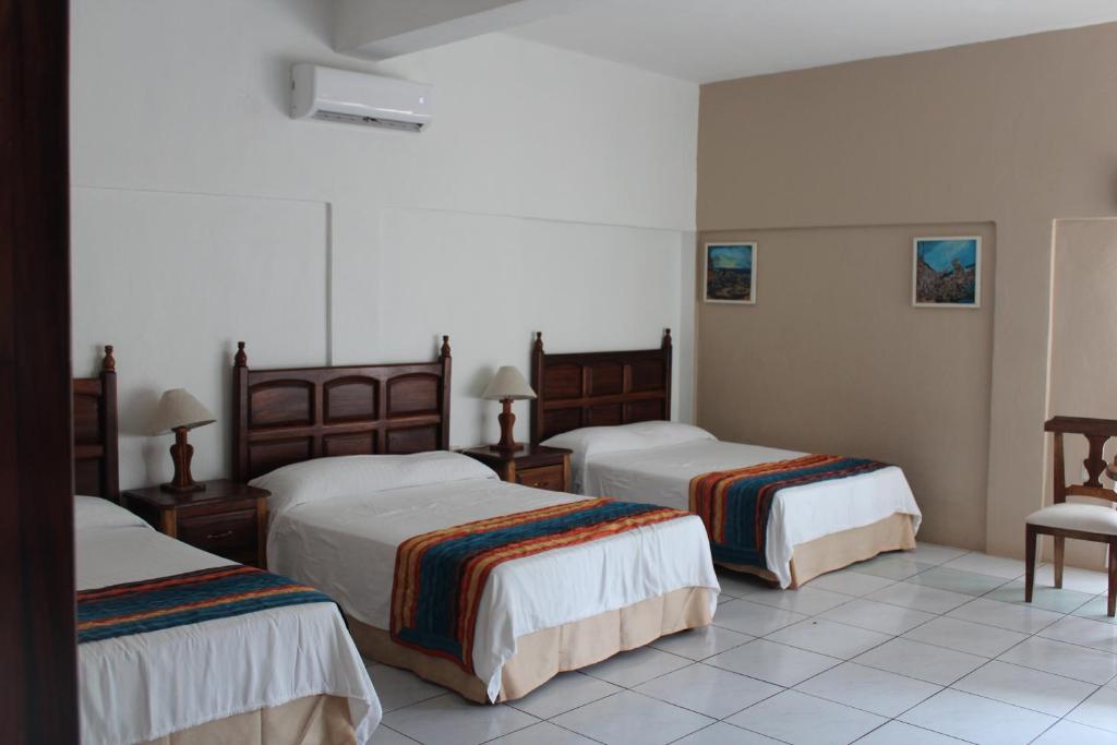 Postel nebo postele na pokoji v ubytování Hotel Mayto