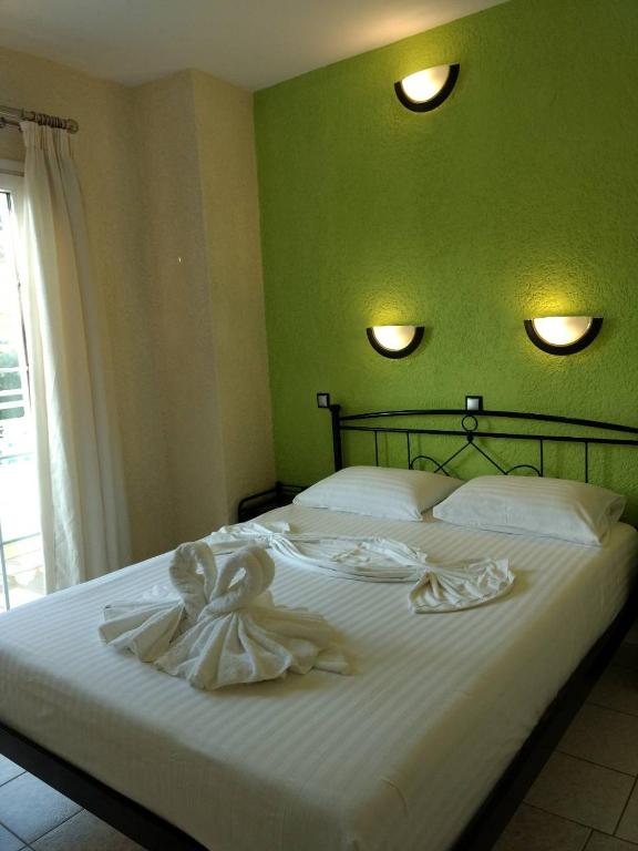 Postel nebo postele na pokoji v ubytování Evelin hotel