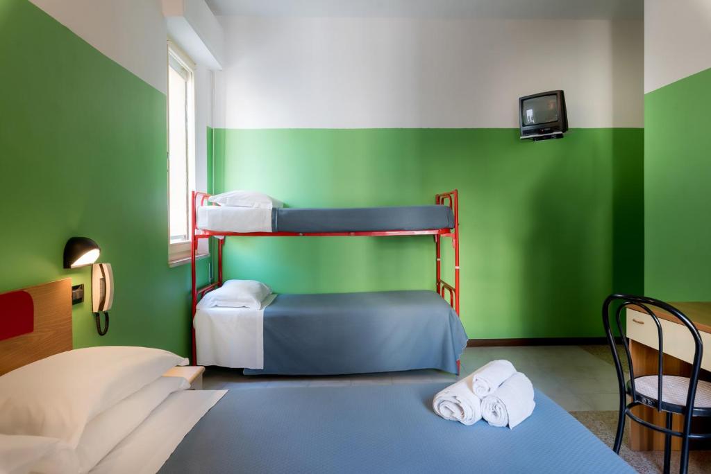 Postel nebo postele na pokoji v ubytování Hotel T Depandance
