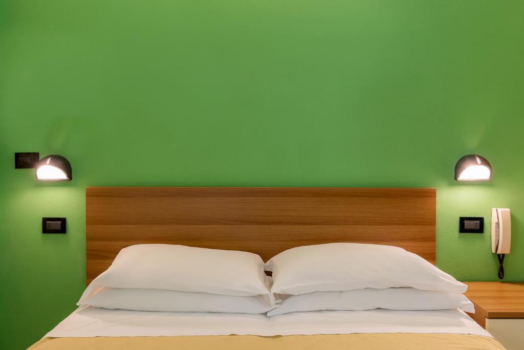 Postel nebo postele na pokoji v ubytování Hotel T Depandance