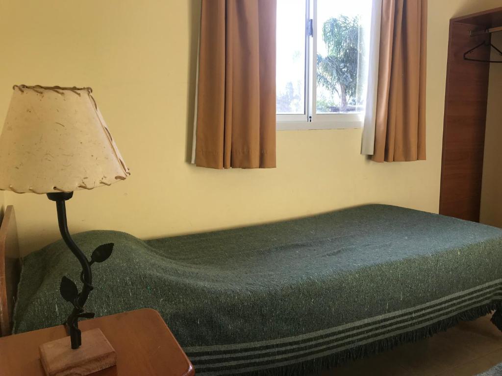 מיטה או מיטות בחדר ב-Cabañas Las Primorosas
