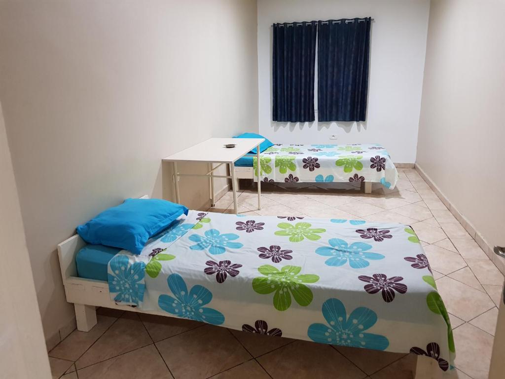 Una cama o camas en una habitación de Hotel Afef