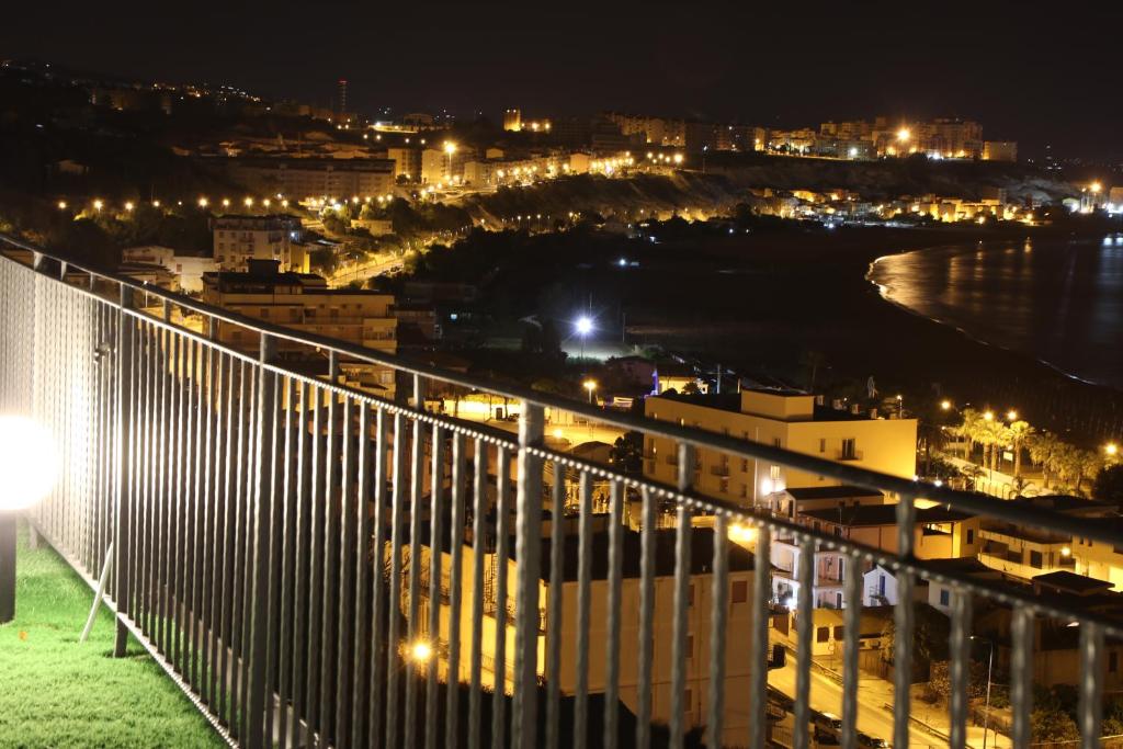 a view of a city at night at B&B Vista sul Mare in Porto Empedocle