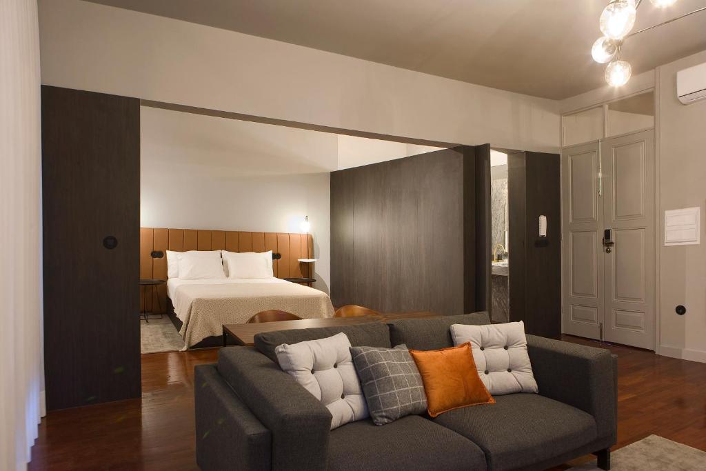 En eller flere senge i et værelse på Oporto Cozy Design Studio - Solar da Avenida
