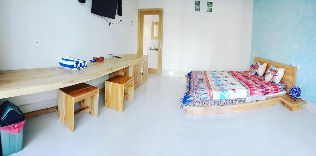 Postel nebo postele na pokoji v ubytování Dragonfly Hostel and Homestay