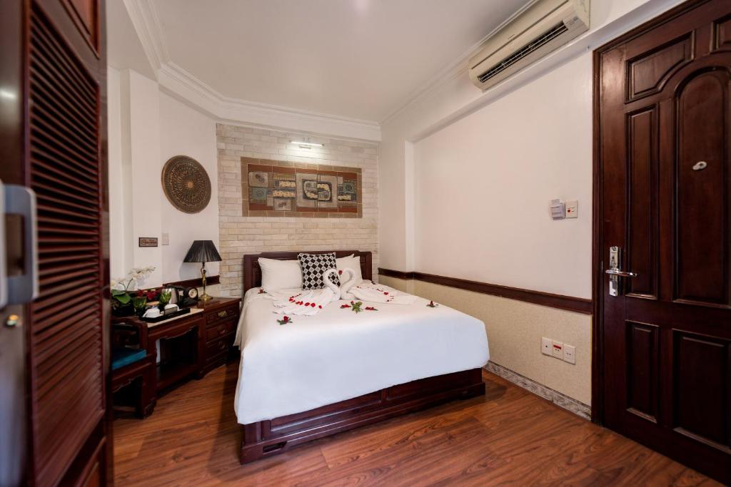 Postel nebo postele na pokoji v ubytování Prince II Hotel