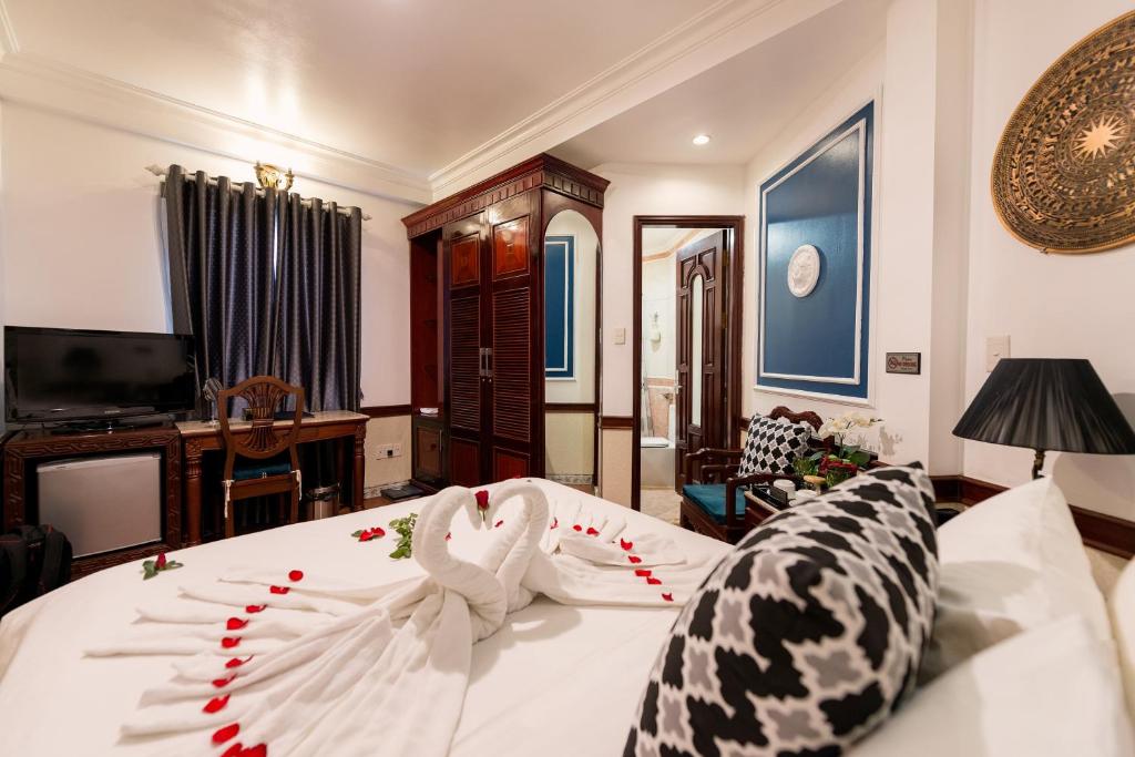 Postel nebo postele na pokoji v ubytování Prince II Hotel