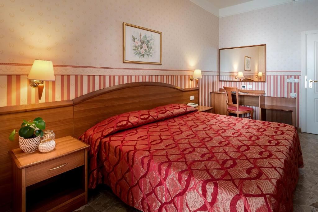 Postel nebo postele na pokoji v ubytování Hotel Tiffany