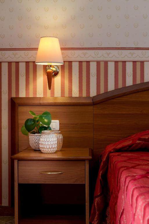 Postel nebo postele na pokoji v ubytování Hotel Tiffany