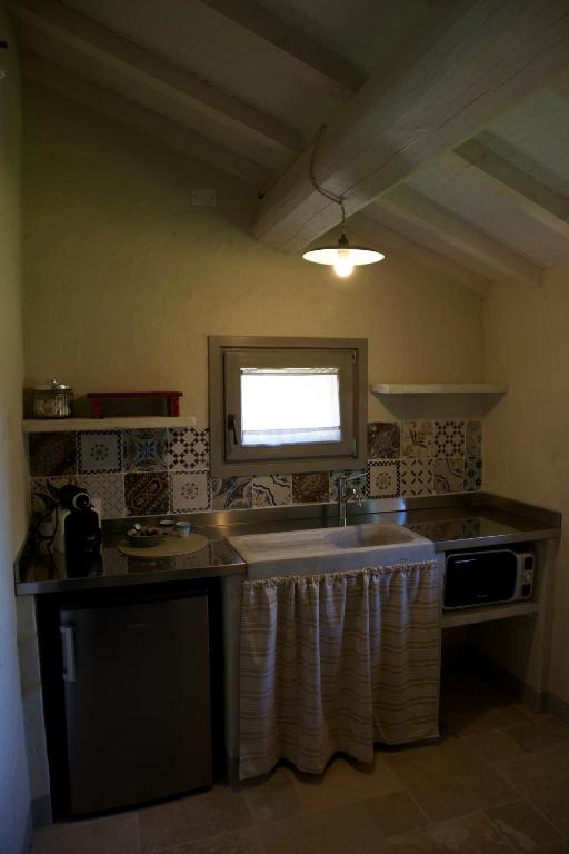 Kuchyň nebo kuchyňský kout v ubytování Le Palazze B&b