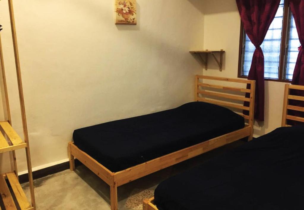 Postel nebo postele na pokoji v ubytování The Retreat Homestay