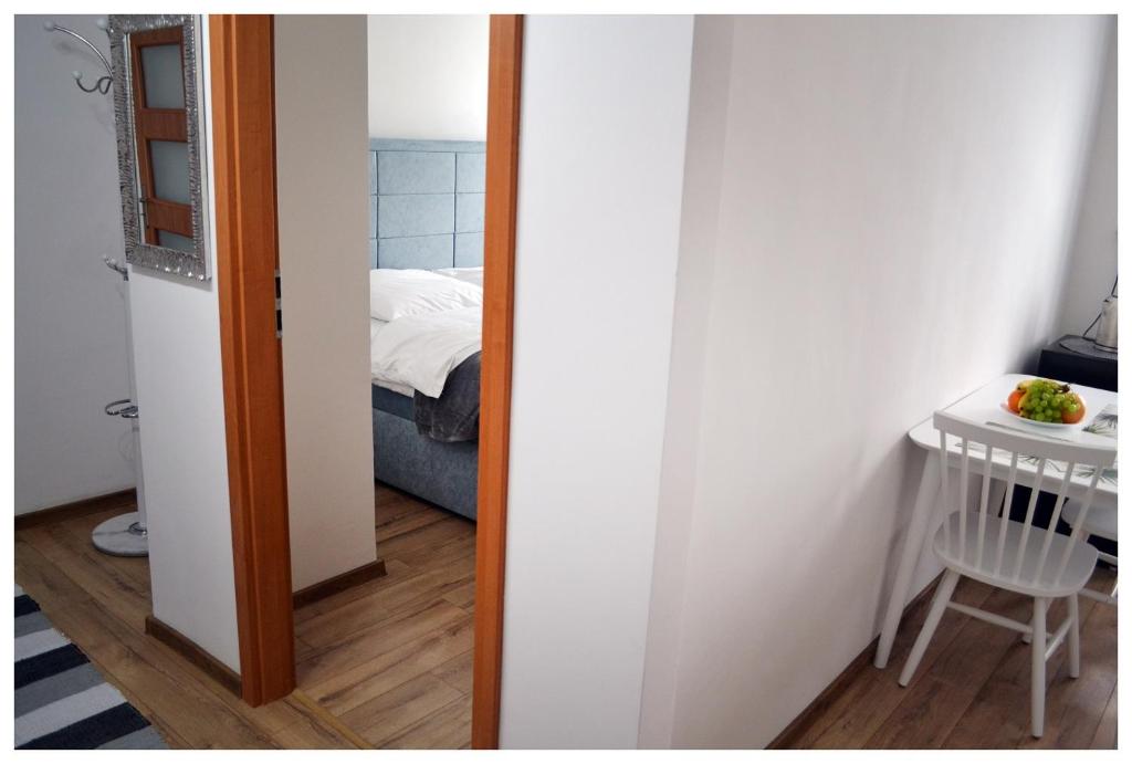 Posteľ alebo postele v izbe v ubytovaní Color24 Apartament