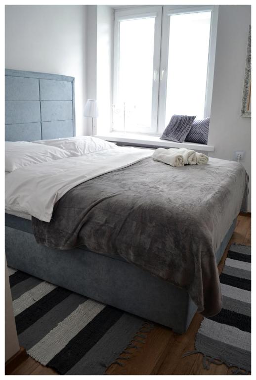 Posteľ alebo postele v izbe v ubytovaní Color24 Apartament