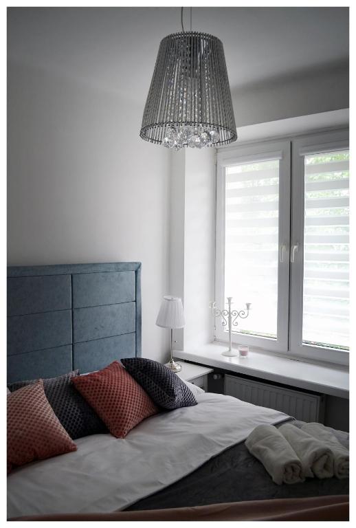Posteľ alebo postele v izbe v ubytovaní Color24 Apartament