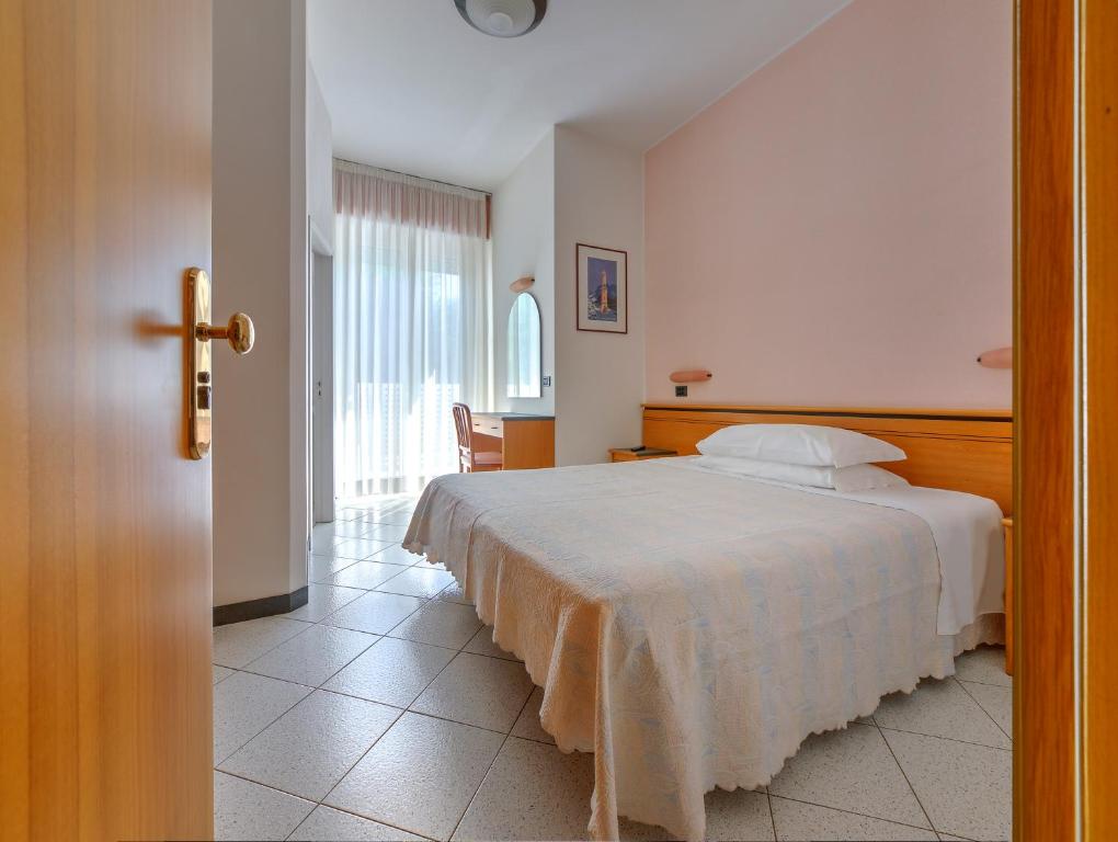 Posteľ alebo postele v izbe v ubytovaní Hotel Excelsior