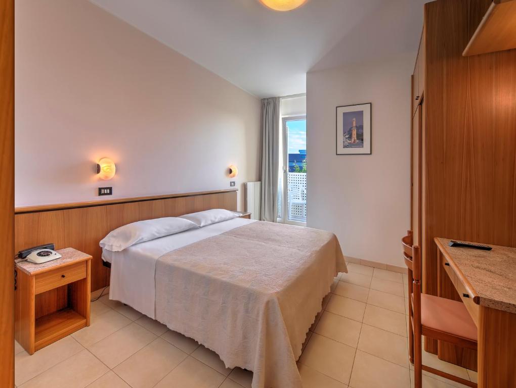 Posteľ alebo postele v izbe v ubytovaní Hotel Excelsior