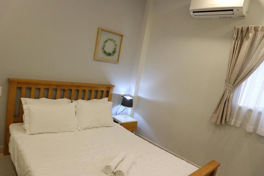 Postel nebo postele na pokoji v ubytování Long Hostel