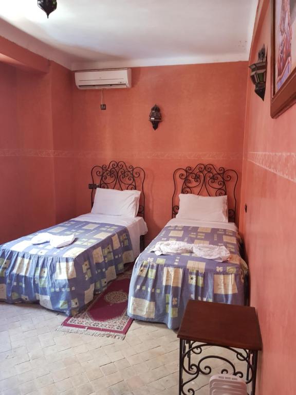 Postel nebo postele na pokoji v ubytování Hotel Wissam