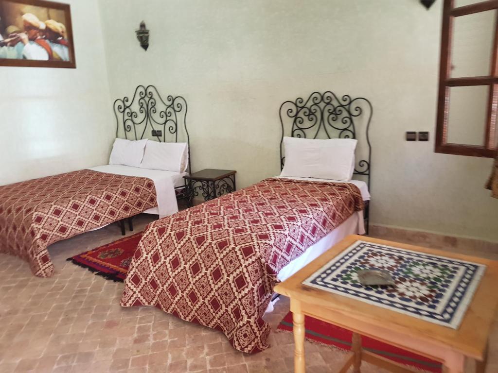 Postel nebo postele na pokoji v ubytování Hotel Wissam