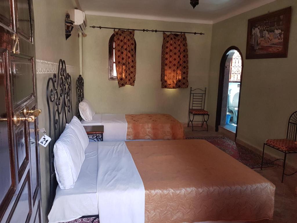 Postel nebo postele na pokoji v ubytování Hotel Wissam